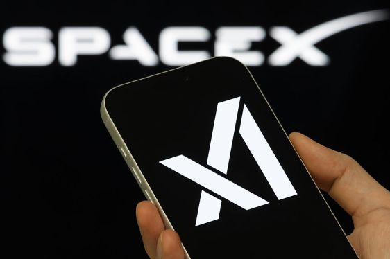 xAI Logo Shown On Smartphone With SpaceX Branding In Background