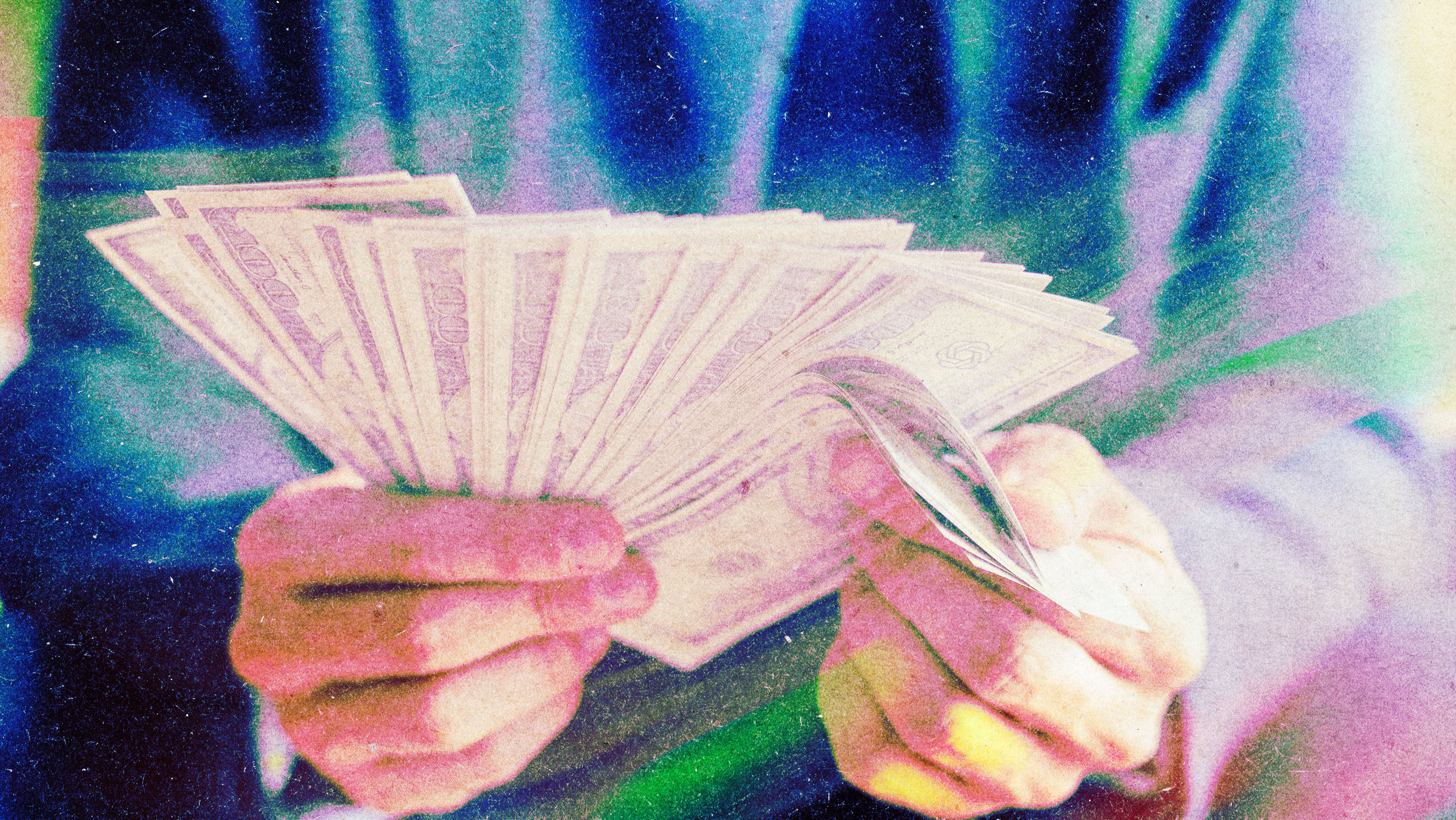 hands peeling back a few bills from a fan of 100s